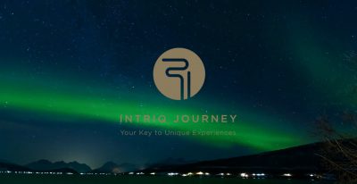 Intriq Journey logo in the background of a green sky