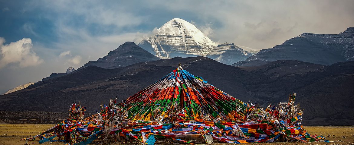 Colourful prayer flags frame the famous sacred Mount Kailash.