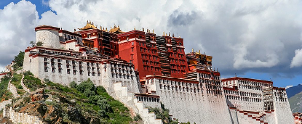 The iconic Potala Palace under a clear blue sky.