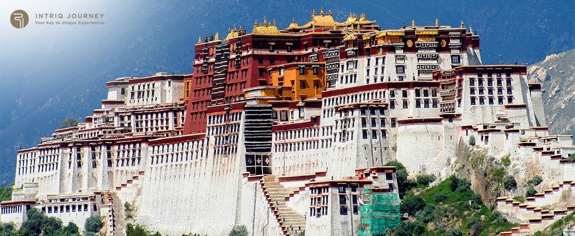 Intriq Journey guide showcasing architectural elements of Lhasa monasteries.