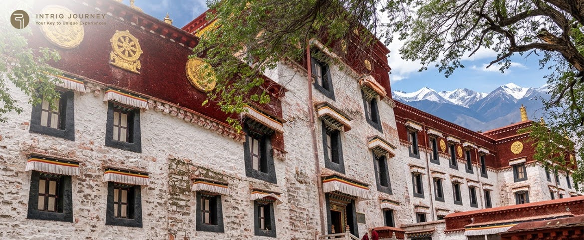 Tour group exploring a large monastery courtyard in Lhasa.