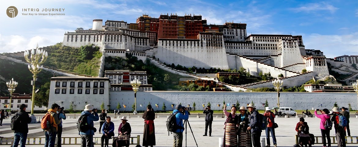 Travelers experiencing the spiritual atmosphere around a historic temple.
